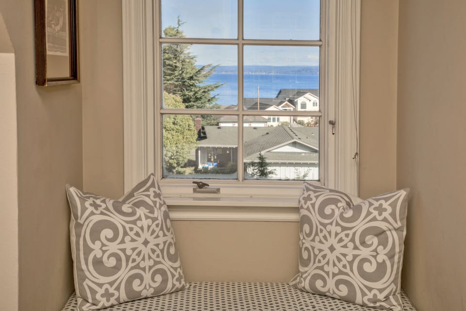 Window seat with water view in upstairs bedroom.
