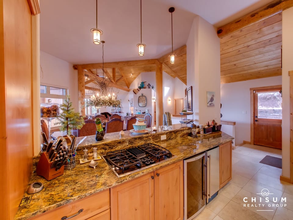 Kitchen bar with view of dining and great room
