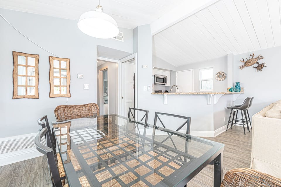 Bright open-concept dining space designed for effortless coastal living
                