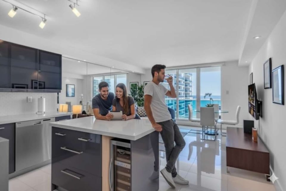 "Gather, sip, and unwind—this sleek kitchen with ocean views is perfect for friends, food, and fun!"