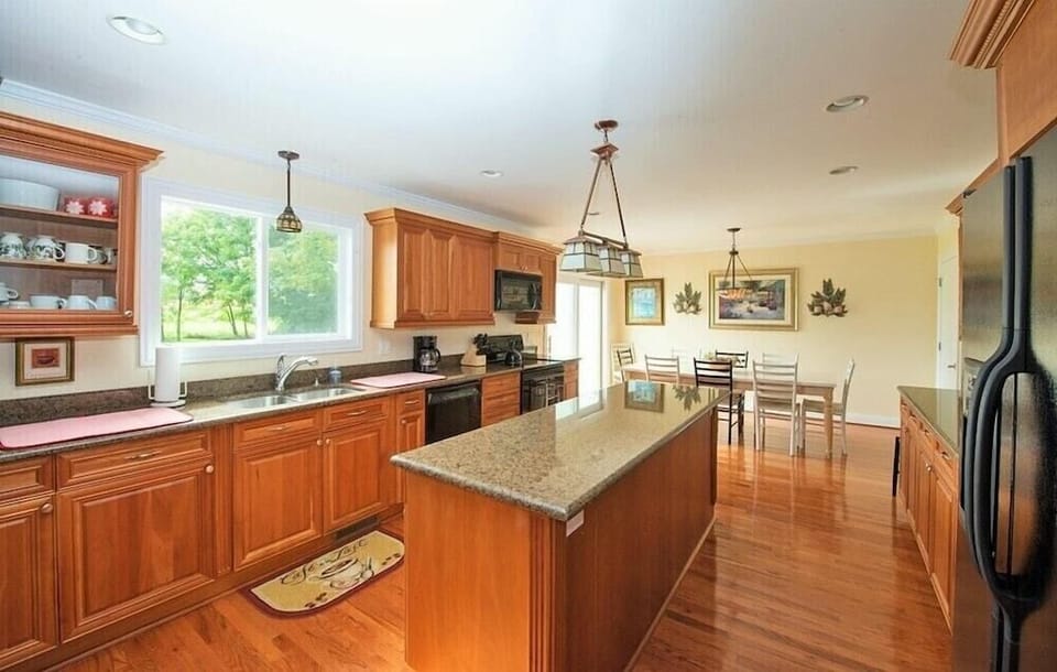Large bright kitchen with island and breakfast area. 