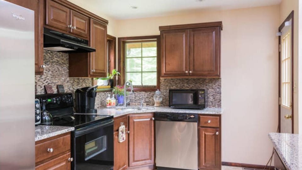 a Chef's delight!  Modern stainless steel appliances and a fully stocked kitchen 