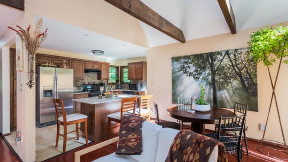 a view from the Great Room into the open-air kitchen