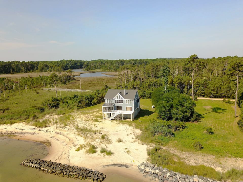 Enjoy wide water views, perfect shallow water, and a soft, sandy private beach