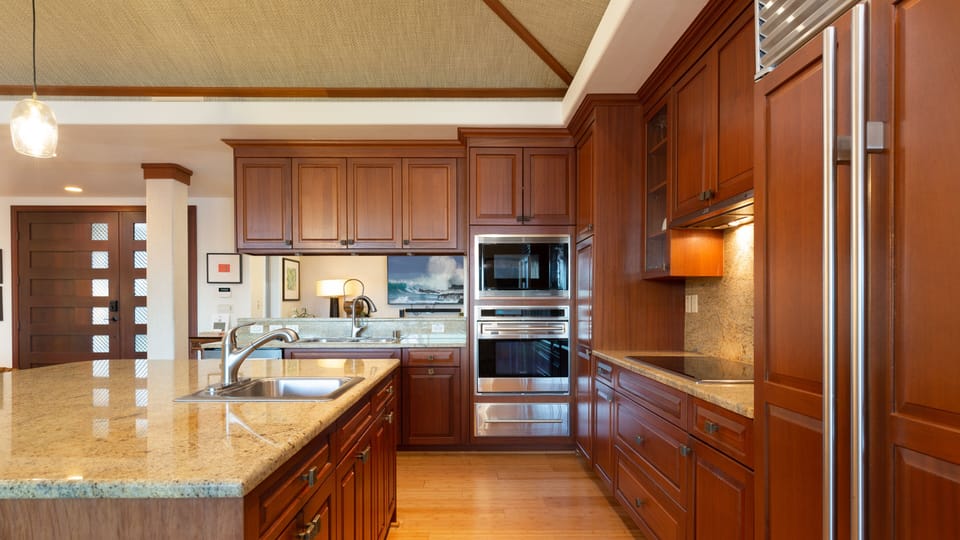 High end appliances and lots of room for preparing delicious island style meals
