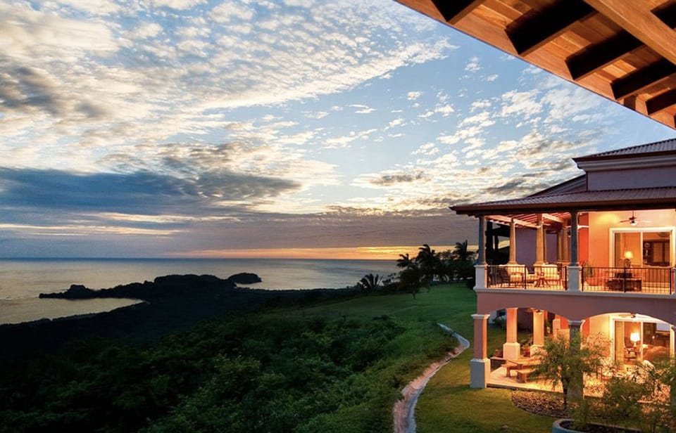 Upper-level condo with oceanview backdrop and spacious outdoor entertaining area