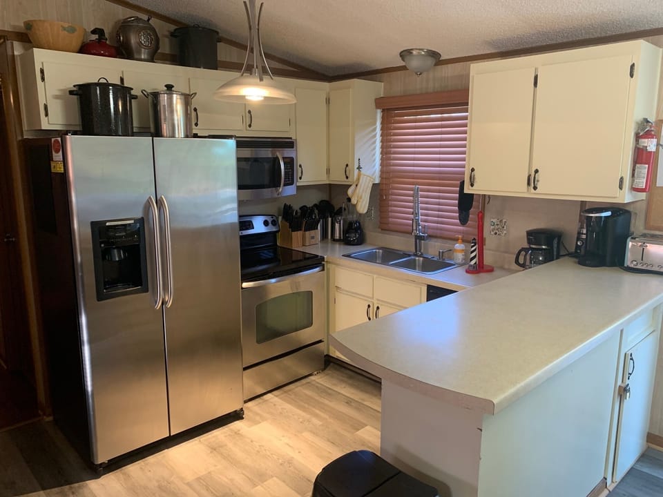 Kitchen features stainless steel appliances