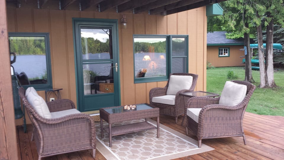 Comfortable deck furniture overlooking the lake. 