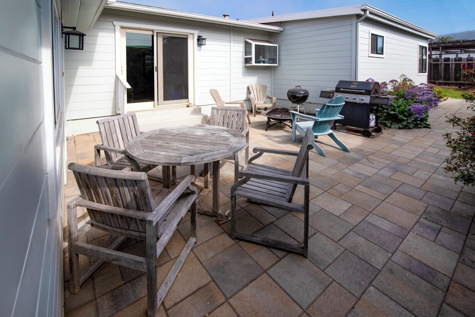 The back patio offers seating and a wonderful place to enjoy the afternoon sun.