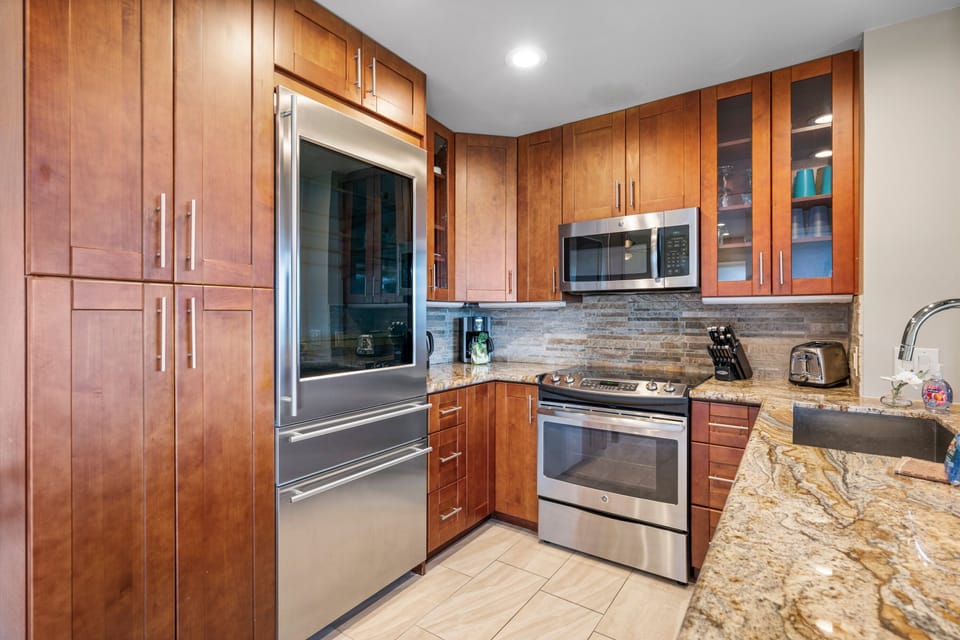 Fully equipped kitchen with stainless steel appliances for all your cooking needs