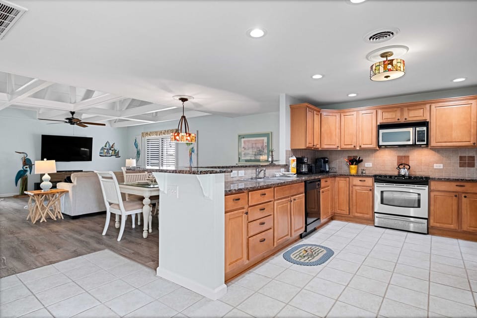 Open concept kitchen, dining room and living room