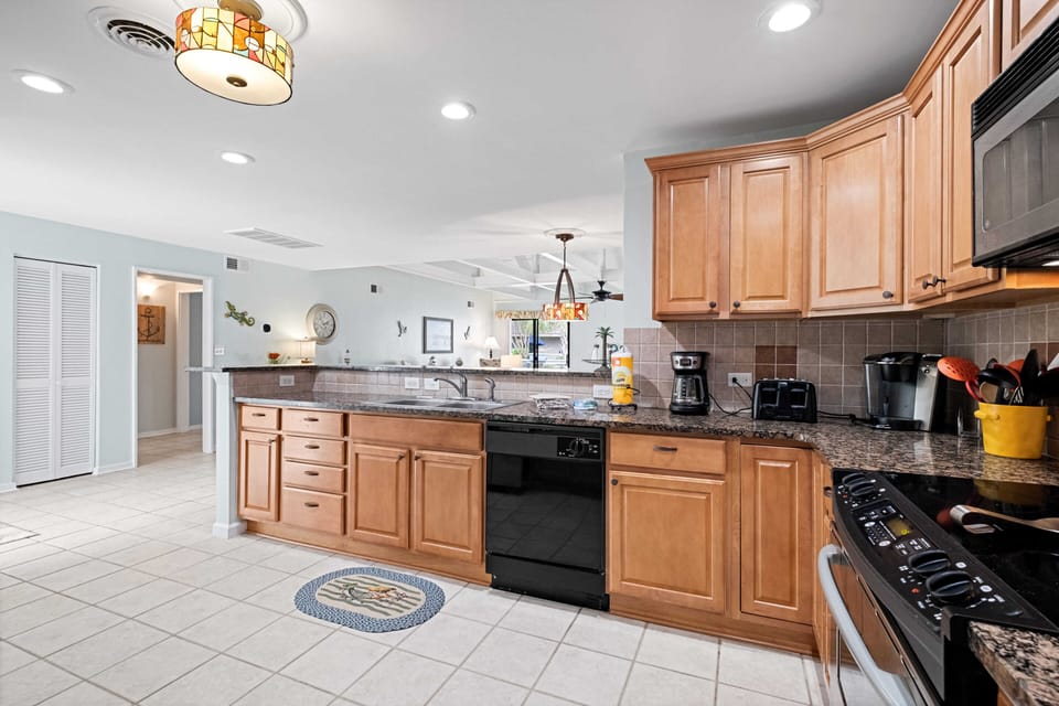 Kitchen with dishwasher, coffee maker, toaster, Keurig
