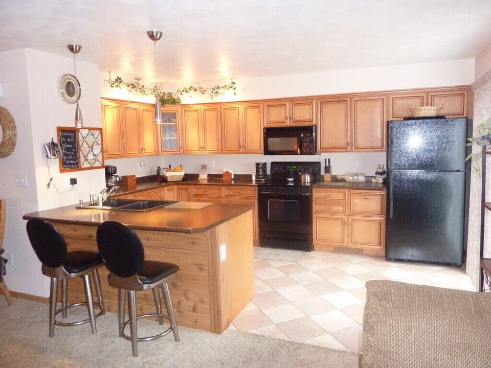Pecan Finished custom cabinets and upgraded appliances. Gas Grill/outside deck