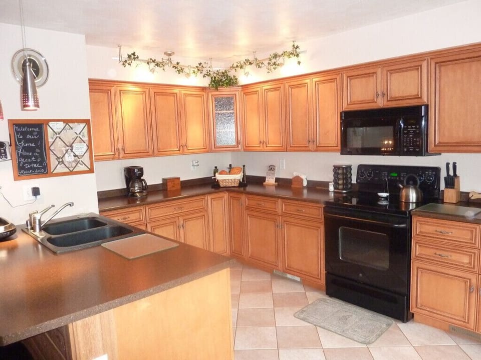 Another view of custom kitchen.