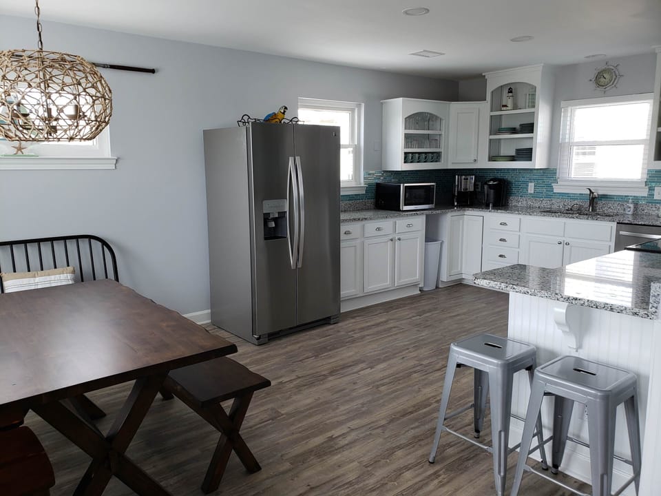 Dining Area into Kitchen and Breakfast Bar. Bar has USB port/electrical plugs