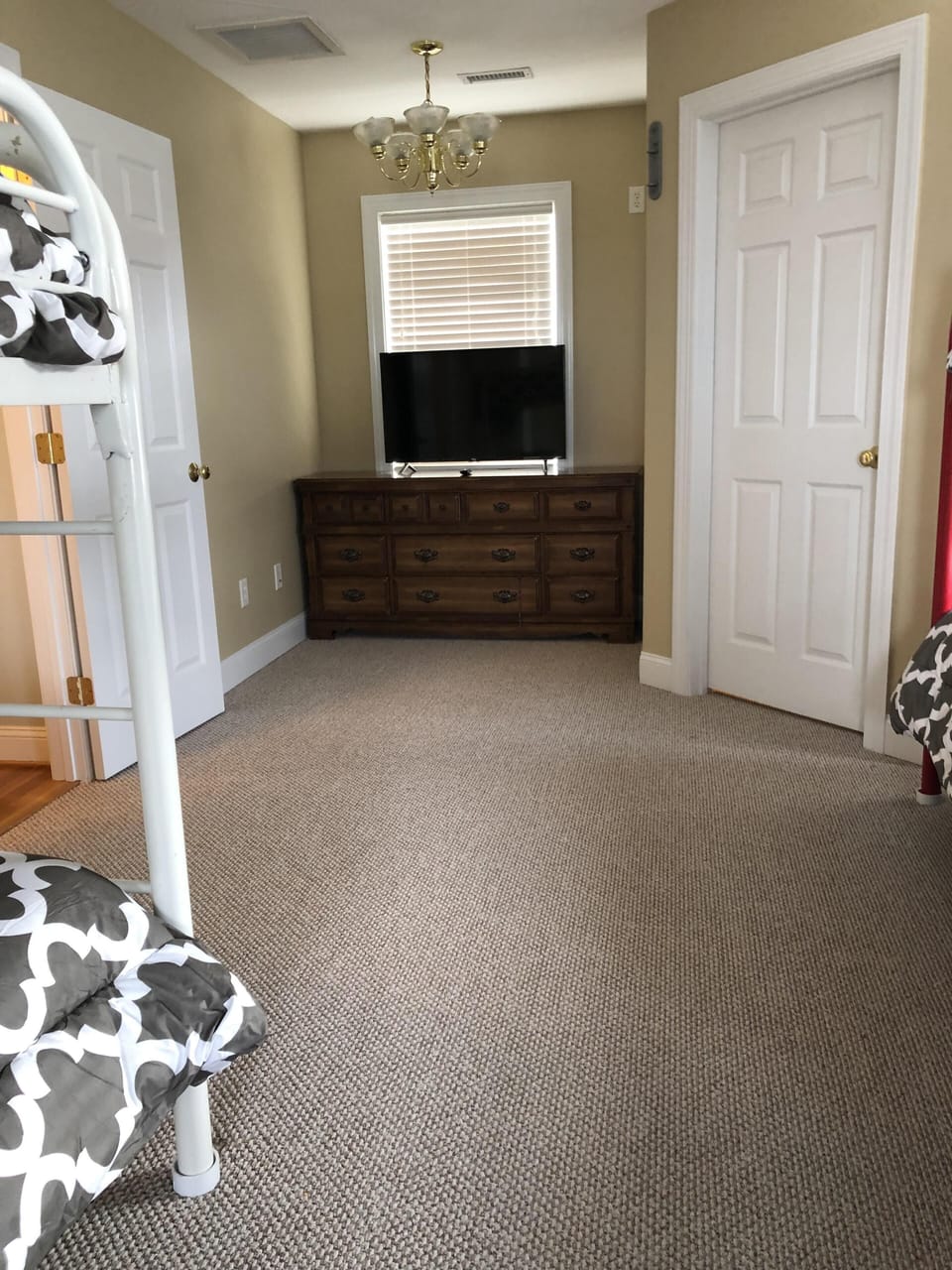 Bedroom 3 with large closet, dresser, tv and DVD player