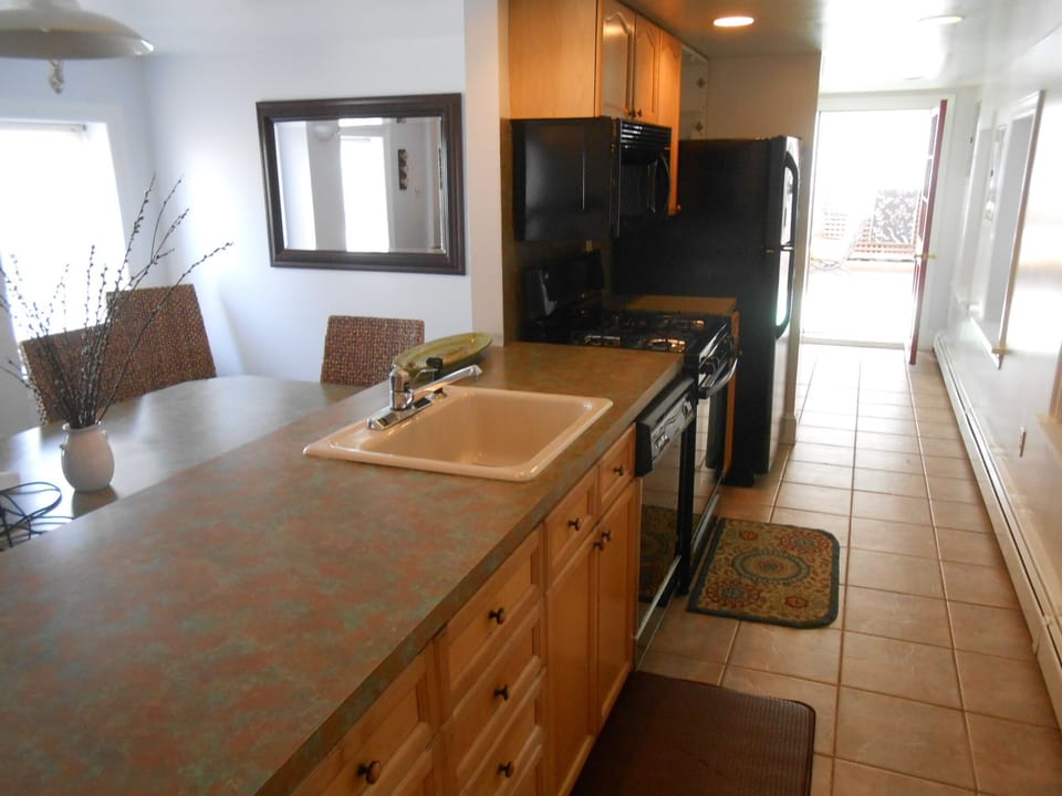 Galley kitchen, large custom table area