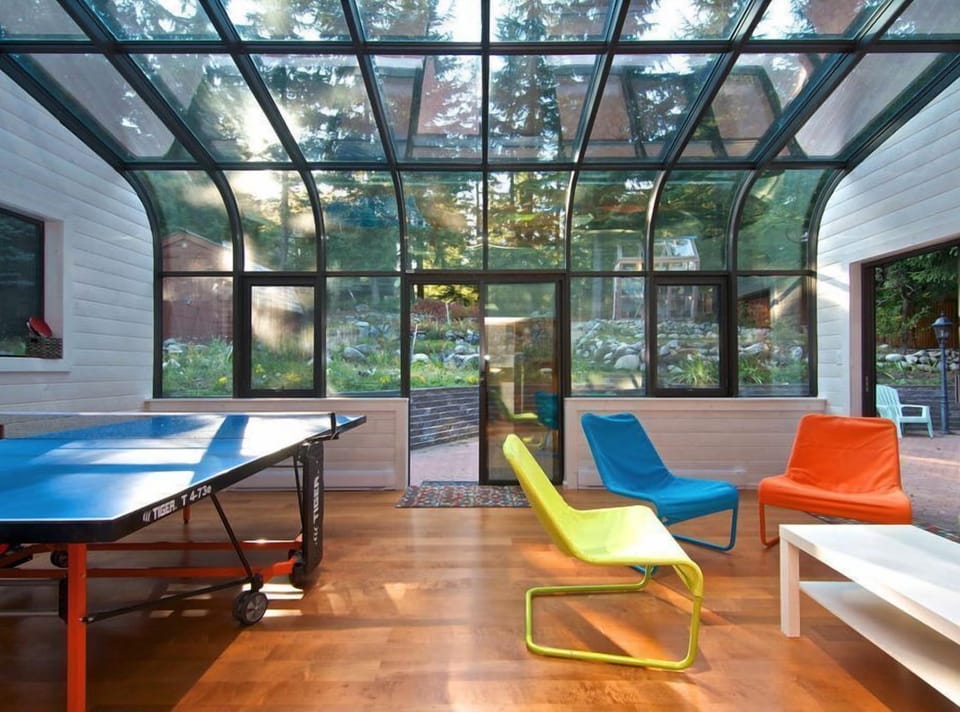 Solarium with ping pong table, lounge chairs and couch.  Rec or reading room!
