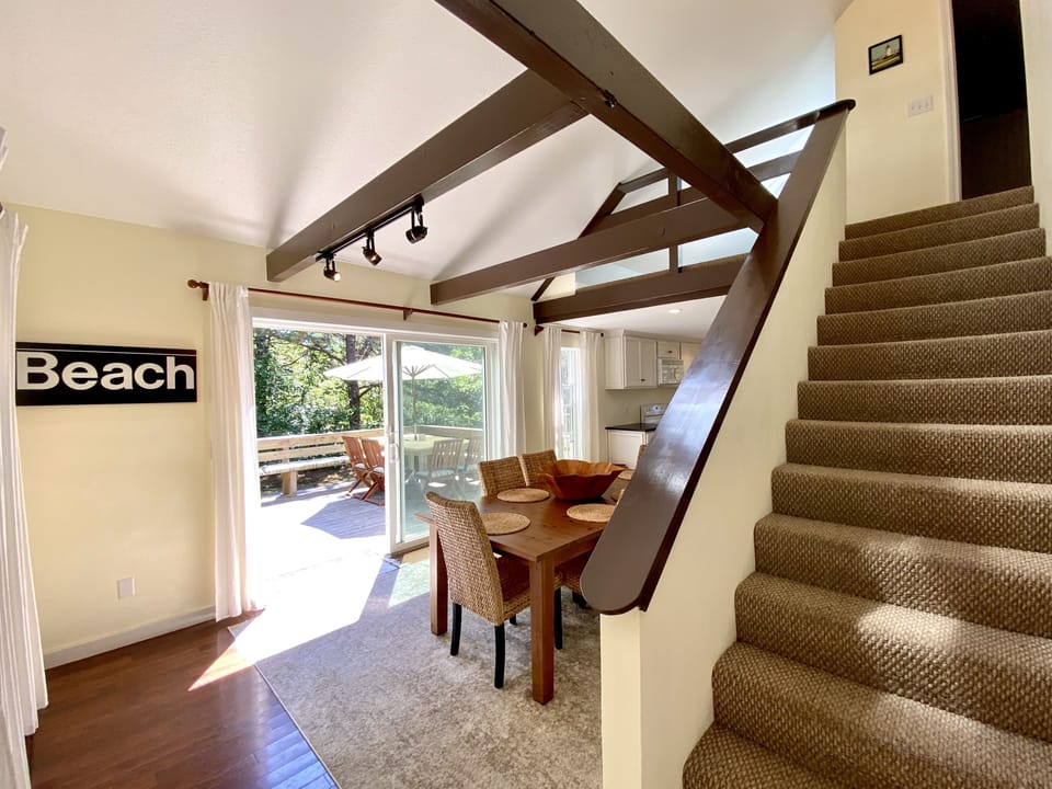 View of Stairs to Second Floor, Dining Room and Patio Doors