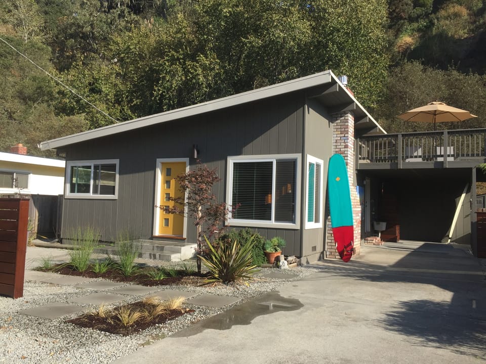 Front of house.  driveway accommodates two cars, in addition to carport