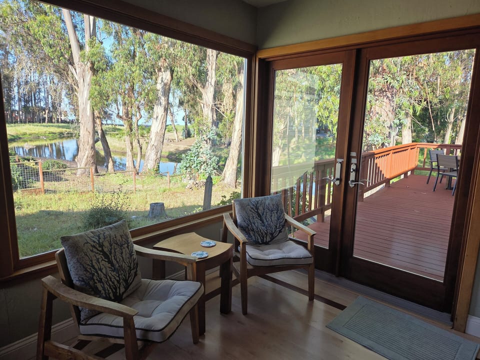 French doors to upper deck from living room