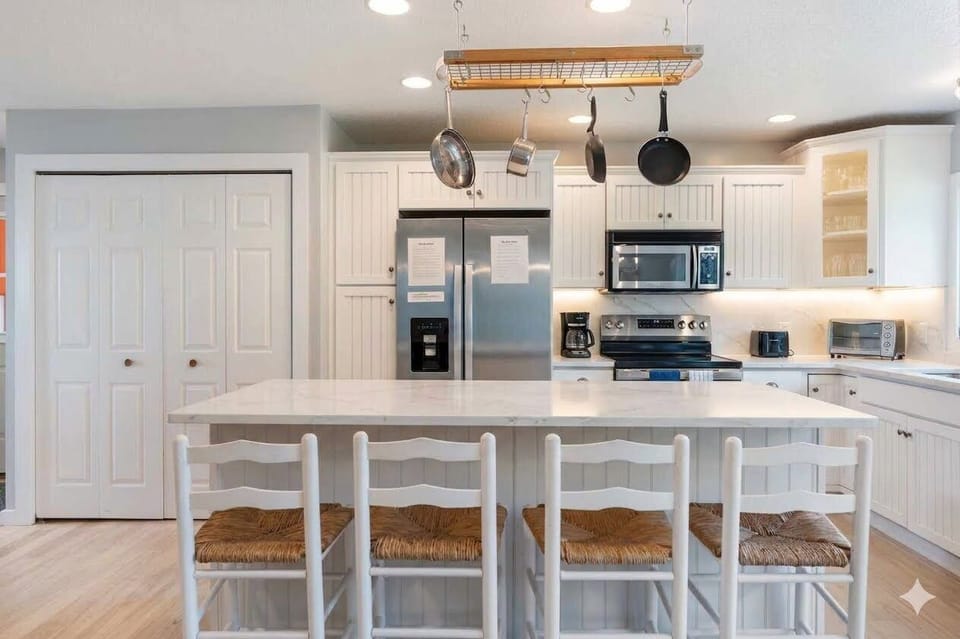 Large kitchen with new stone counters and under cabinet lighting