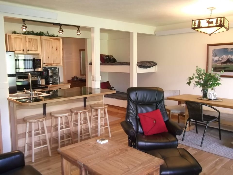 open kitchen, living area and bunk beds