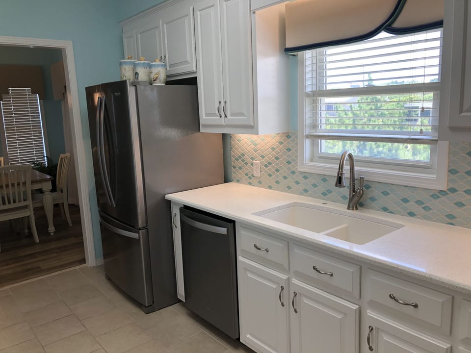 Kitchen has stainless appliances.