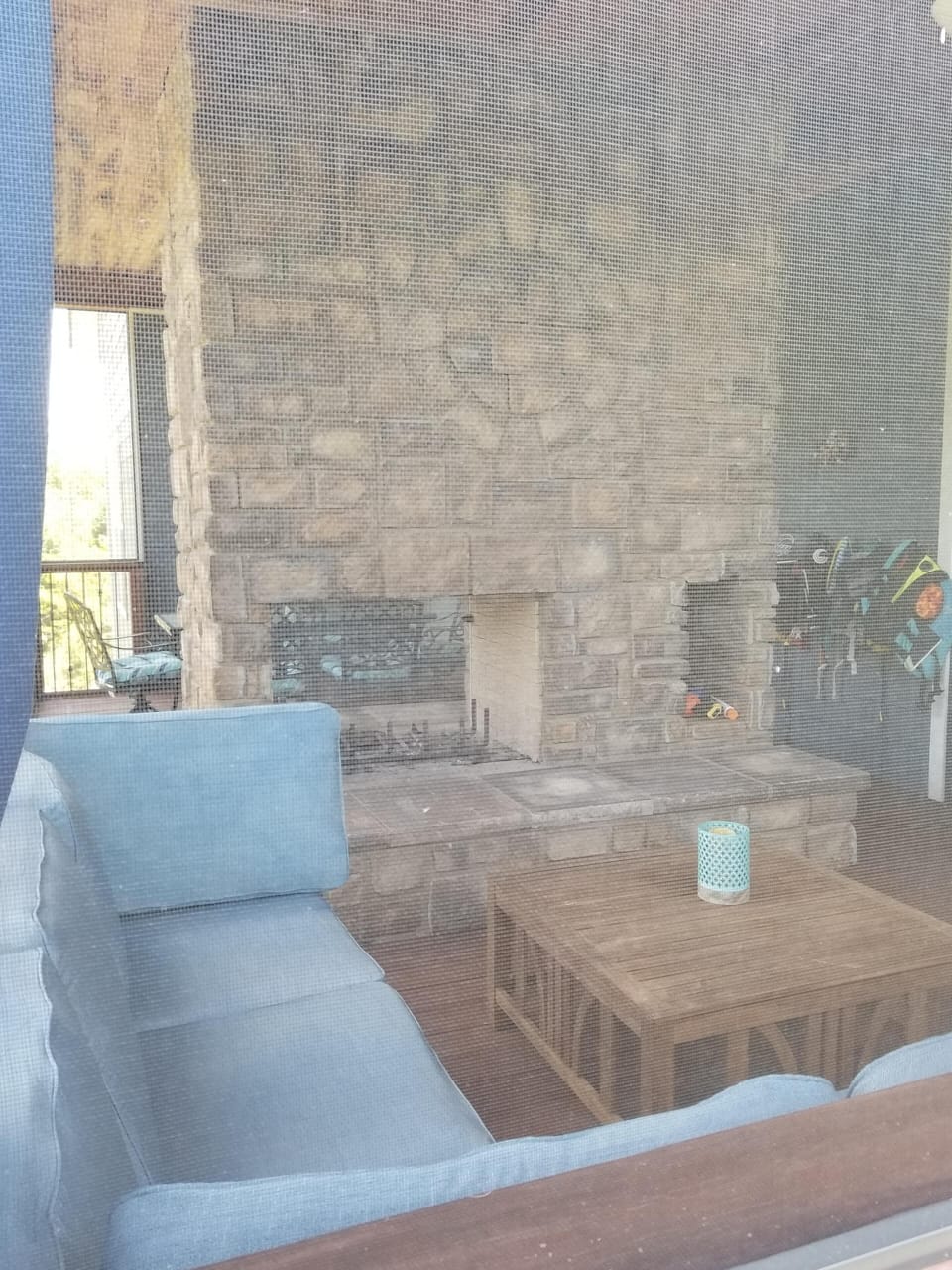 Seating area on back deck with fireplace