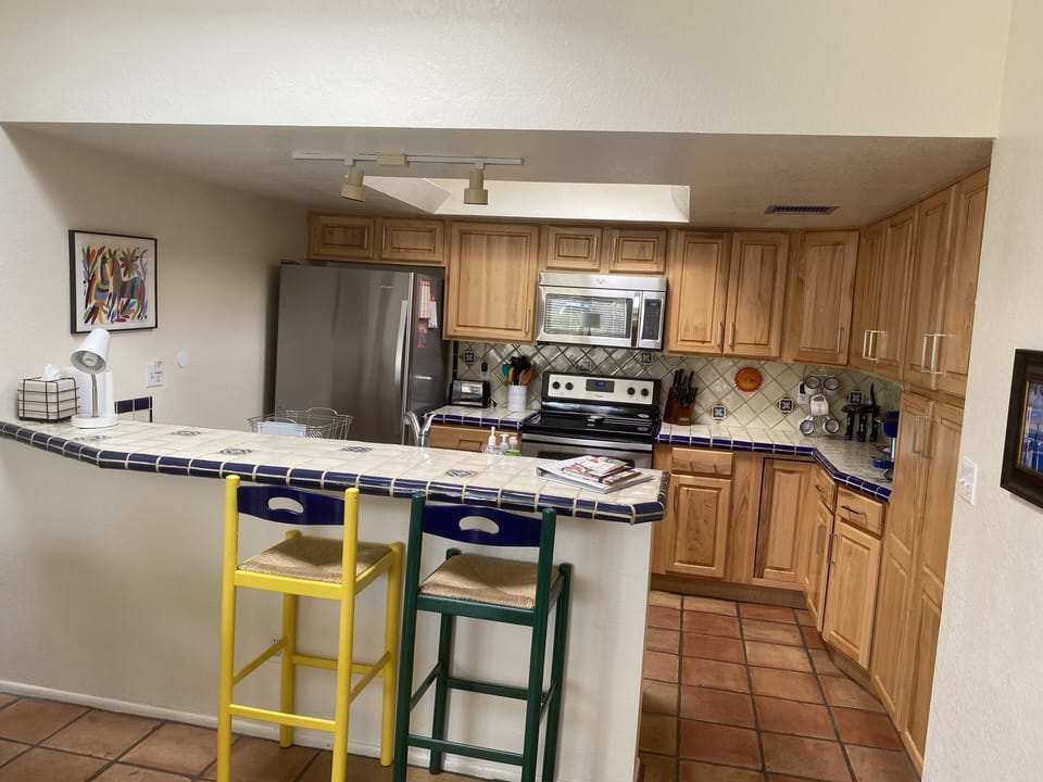 Kitchen with eati-in bar counter, beautiful hickory custom cabinets