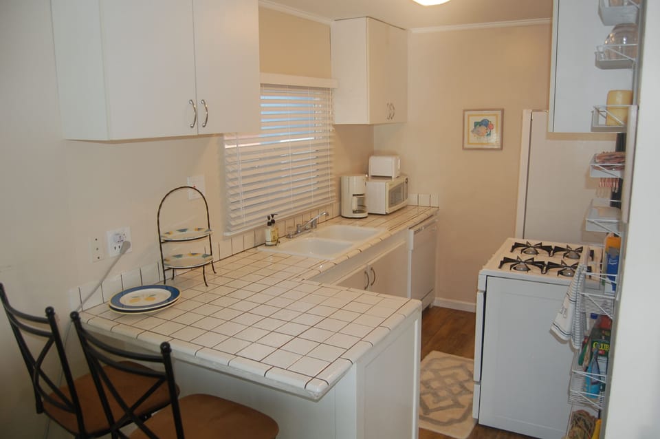 Fully stocked kitchen with bar counter.