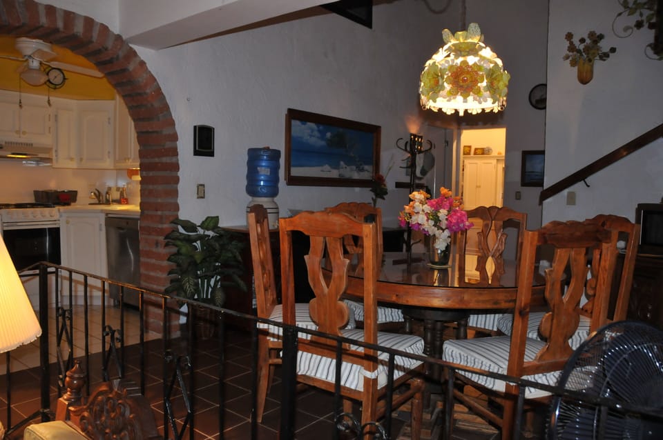Dining area with Kitchen showing in background on left.
