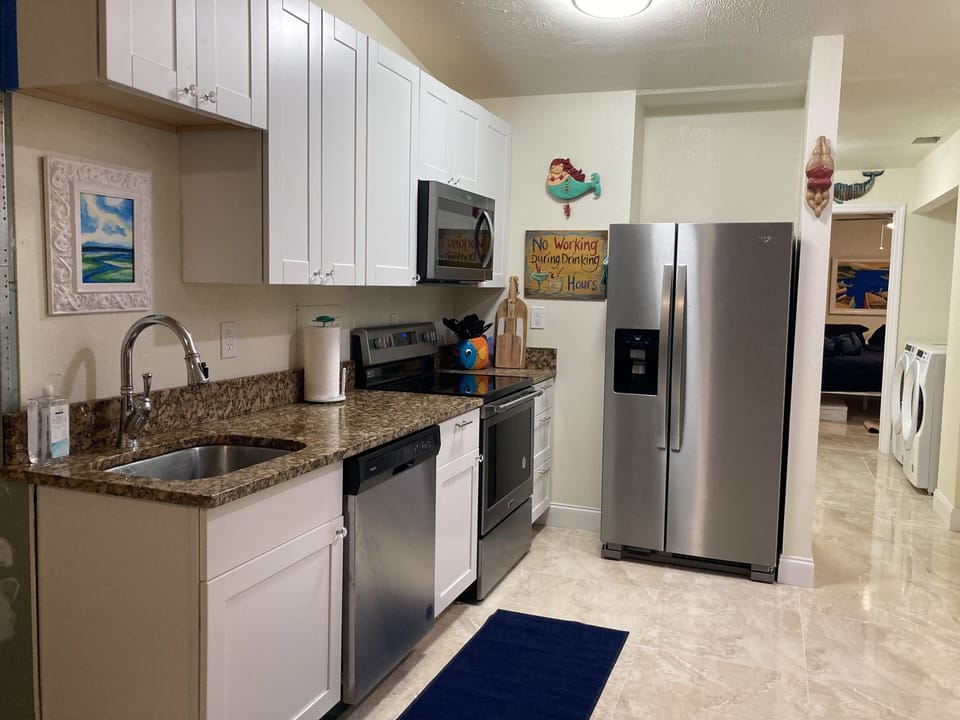 Dishwasher, microwave, stove  refrigerator with ice and filtered water.