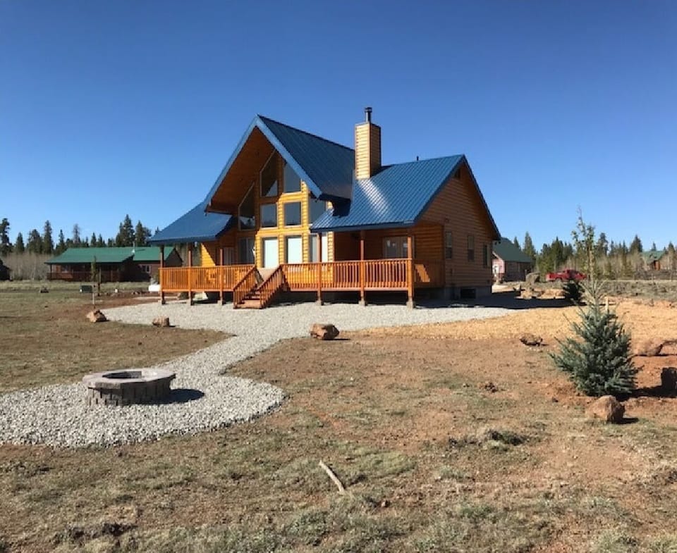 Meadow side of Serene. Newly planted pine trees along with walkway to fire pit.