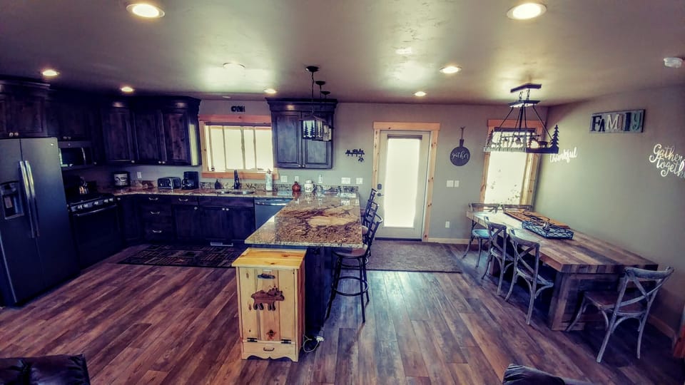 Gorgeous well stocked kitchen and a large Family gathering table awaits you.  