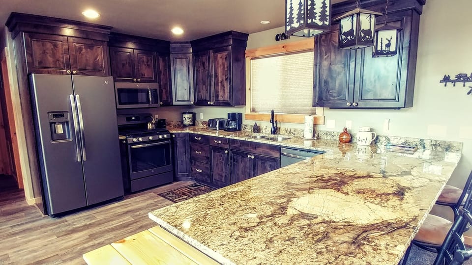 Beautiful and fully stocked kitchen for your mountain cooking experience.