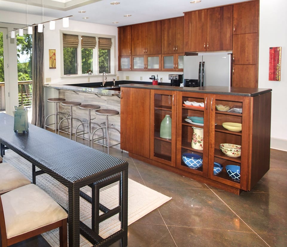 Dining for 8-12 upstairs. Bar for 4 w/ cool stools & barnwood siding. 