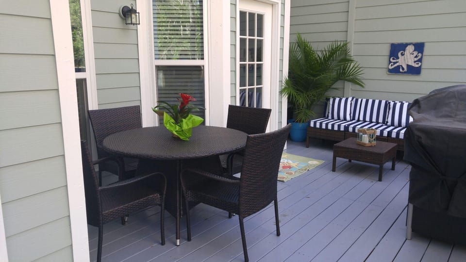 The back deck is perfect for outdoor dining and has a brand new grill.