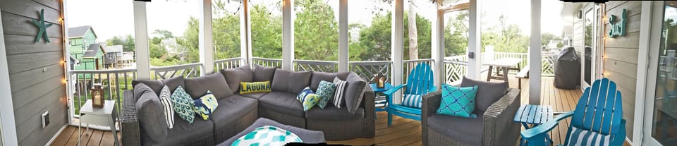Screened-in porch on the top level.  Grill and picnic table on deck outside.