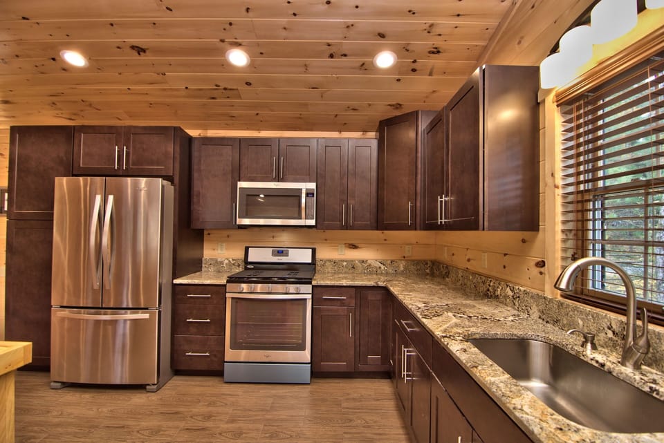 Stainless Steel Appliances Including Granite Countertops And Plenty Of Cabinets!