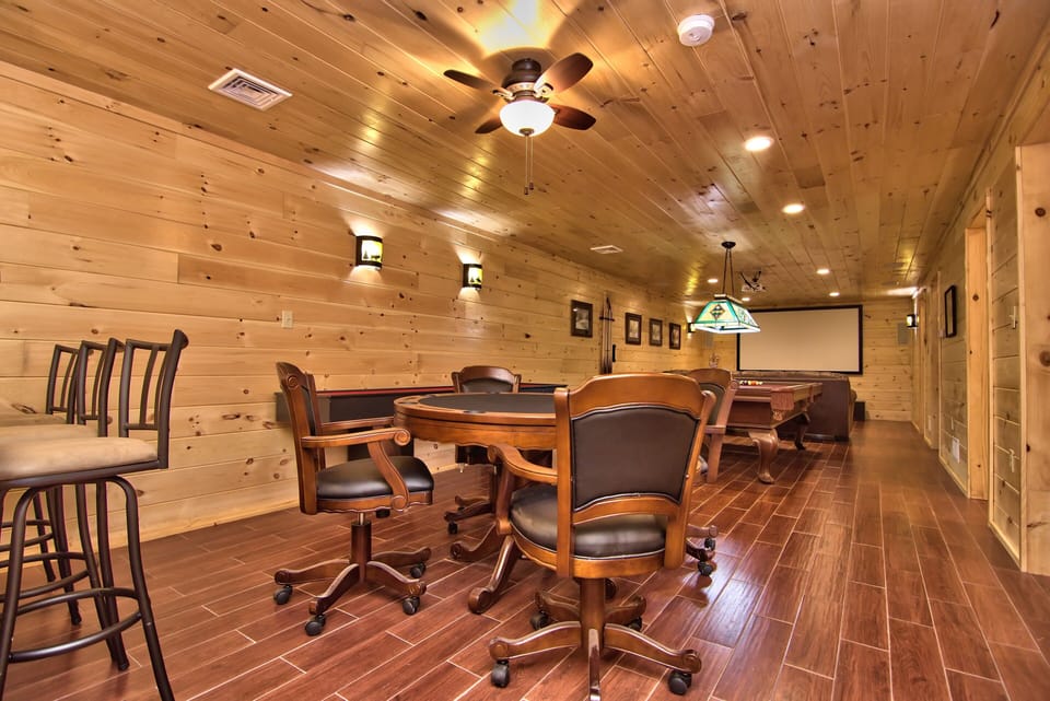 Poker Table With Leather Chairs And Table Top Located On The Lower Level!