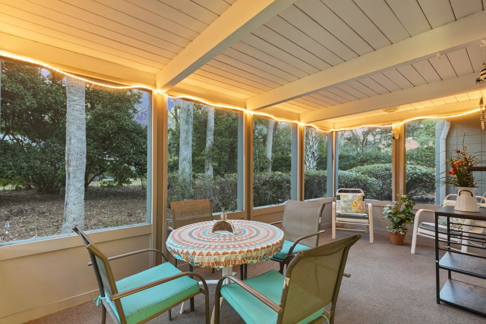 Enjoy the serene wooded view from the back porch.