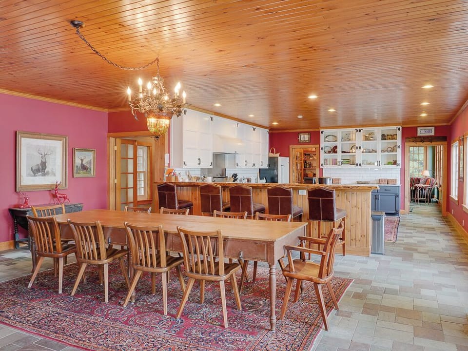 The dining table and kitchen.