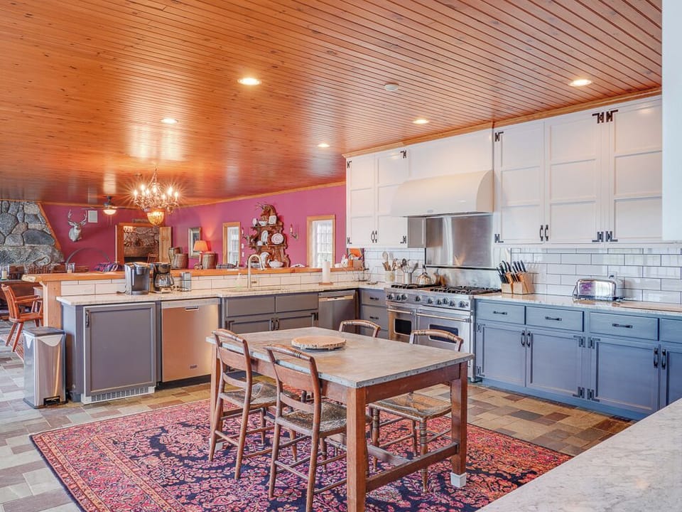 The kitchen features high-end appliances and two dishwashers.