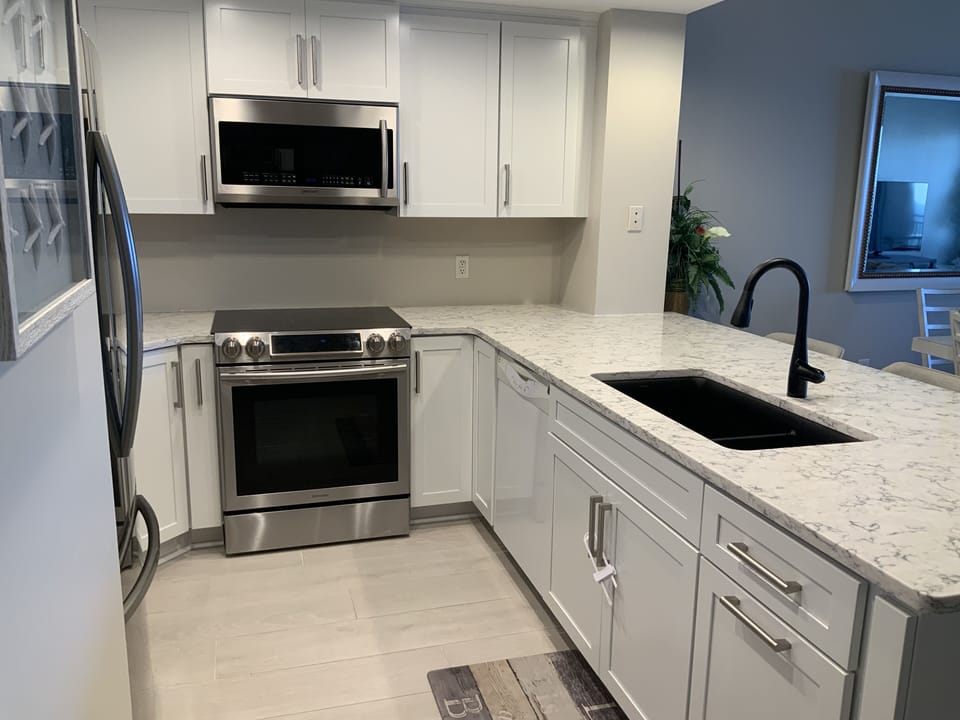 New high end kitchen with stainless appliances