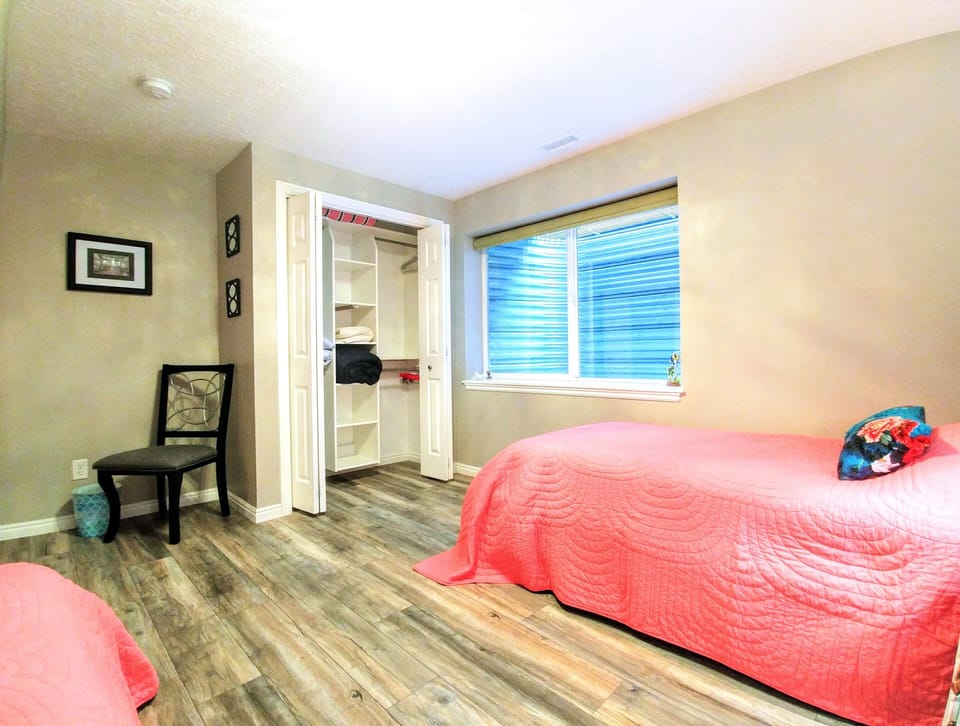 2nd bedroom, large window and closet with hangers