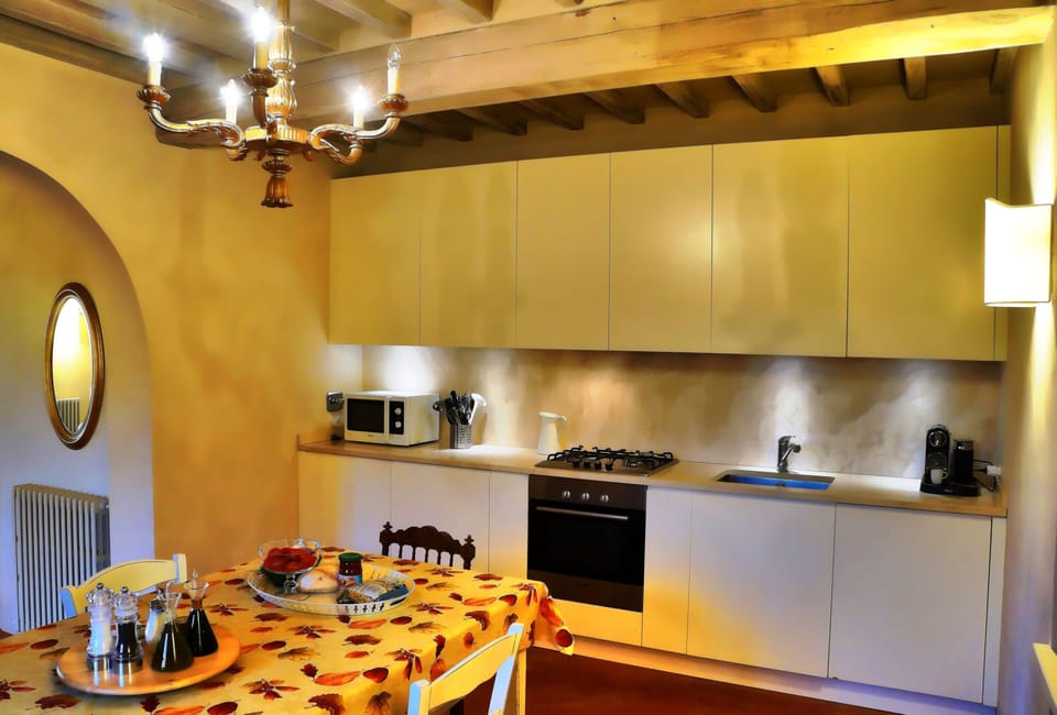Fully equipped travertine kitchen looking towards the Lounge.