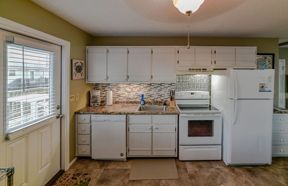 Kitchen dishwasher, stove, and fridge 