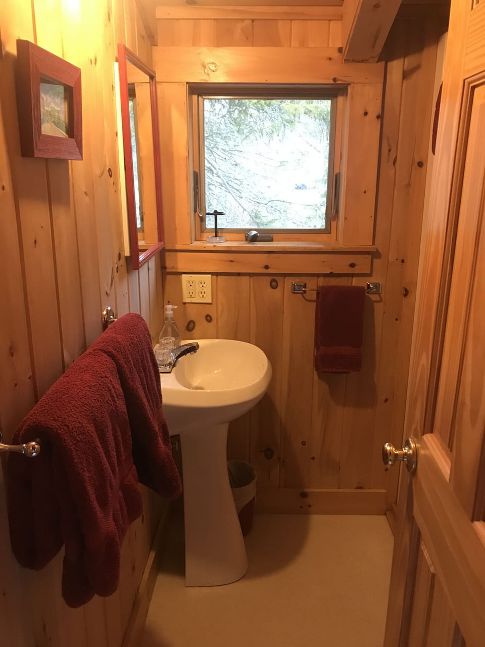 Small bath with shower,sink, and toilet main floor.