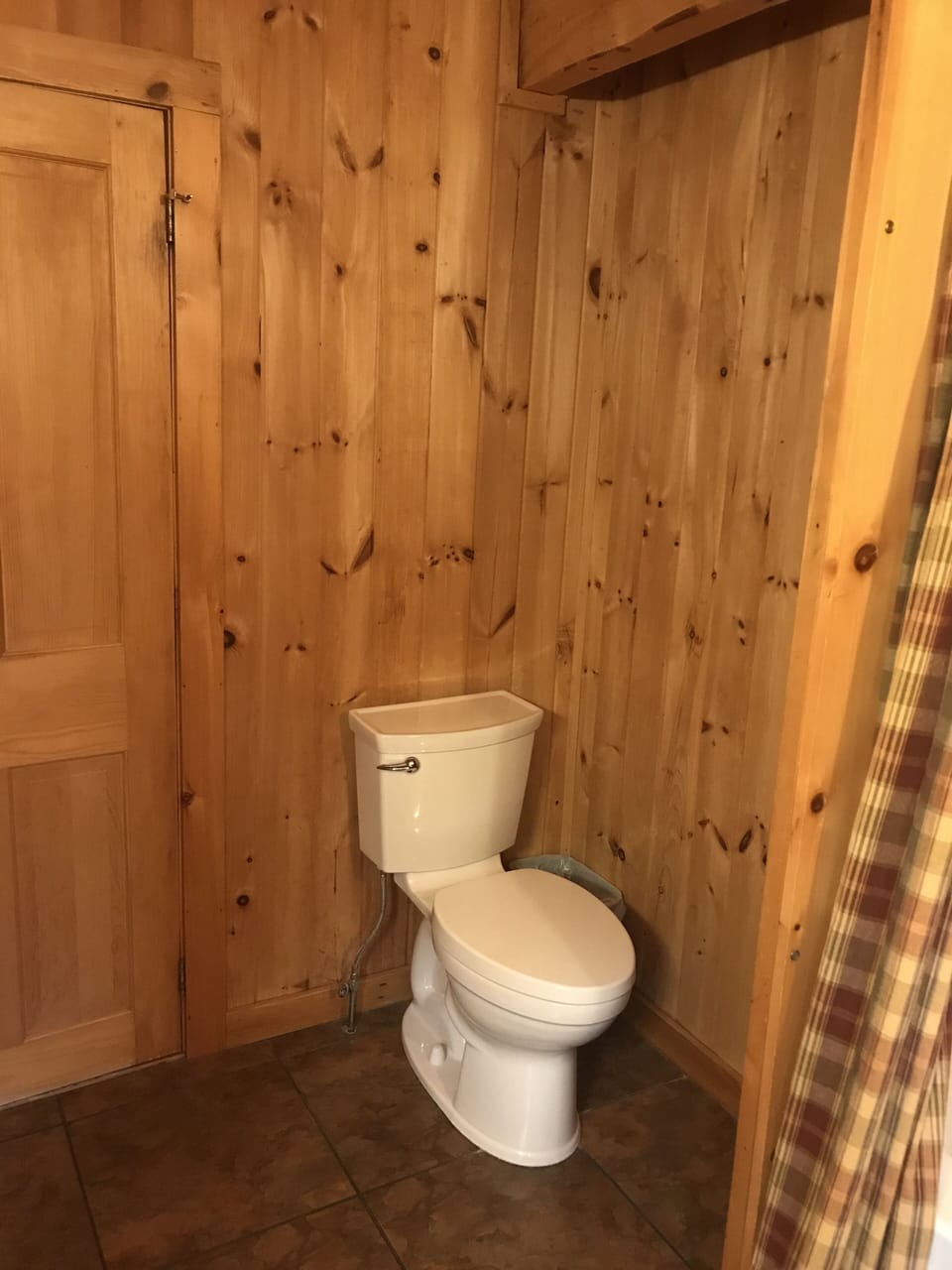 Toilet in Main Bath with bath Tub and Shower Unit

